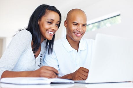 Couple looking at a computer.